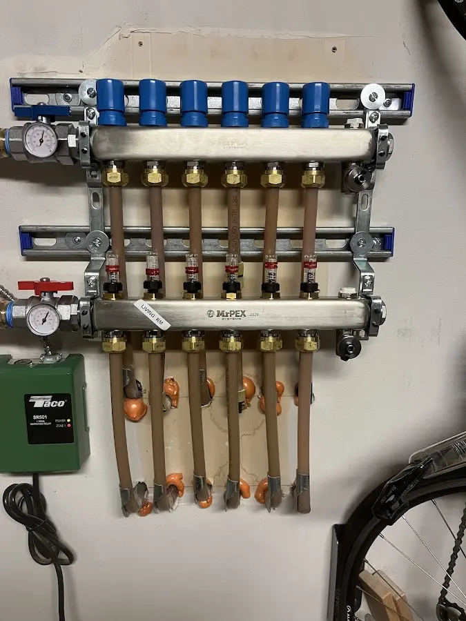 Plumber performing Leak Detection at a residential property in Longmeadow